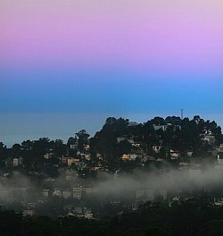 Earth's shadow (blue) and the Belt of Venus (pink) at dawn, seen above the Pacific Ocean (blue-grey), looking west from Twin Peaks, San Francisco Since the angular sizes of the Sun and the Moon, visible from the surface of the Earth, are almost the same, the ratio of the length of the Earth's shadow to the distance between the Earth and the Moon will be almost equal to the ratio of the sizes of the Earth and the Moon. Since Earth's diameter is 3.7 times the Moon's, the length of the planet's umbra is correspondingly 3.7 times the average distance from the Moon to the Earth: roughly 1,400,000 km (870,000 mi). The width of the Earth's shadow at the distance of the lunar orbit is approximately 9000 km (~ 2.6 lunar diameters), which allows people of the Earth to observe total lunar eclipses.