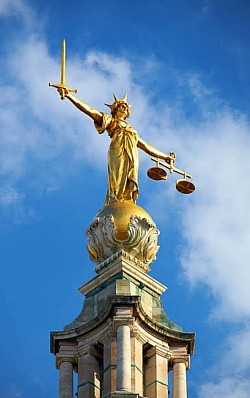 The Crowned lady of Justice in ? , The Ge 1) like Geode as Flat as flat earther. [A believer in a conspiracy theory, especially that the earth is flat . e.g. Despite overwhelming scientific evidence, the flat earther insisted that the planet was a disc.] or 2) like Earth as Globe. Or 3) The illegal matters of geography. ★ An armed emperor at a crowning (coronation), I  never heard of it , Why not ? Dagger and the crown if use wisely can take someone very far. A synonym of Murder [collective noun of Crows] by death.💥 French phrase, En ma fin est mon commencement (